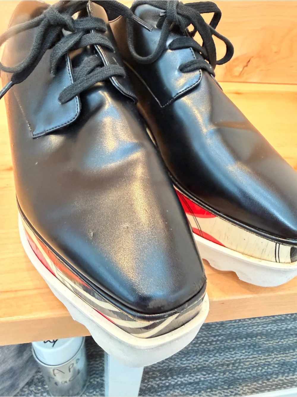 Stella McCartney Black Leather Elyse Platform Shoes with abstract design.